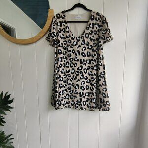 Dress in a Leopard Print by Adrienne. Desirable & Sleek dress fully lined. Sz L